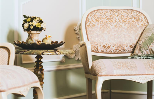 Softly staged vintage armchair and marble side table styled with florals—showcasing Sandra Boulay’s signature touch for creating warm, buyer-ready spaces in West Island homes.